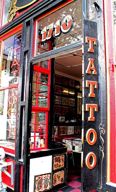 tattoo parlor window pictures | tattoo parlor door Tattoo Shop Front Window, Traditional Tattoo Shop Interior, Tattoo Shop Pictures, Tattoo Shop Aesthetic Grunge, Vintage Tattoo Shop Aesthetic, Tattoo Shop Exterior, Door Tattoo Ideas, Tattoo Parlor Interior, Tattoo Parlor Aesthetic