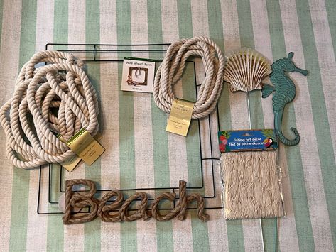 how to make a dollar tree coastal wreath Coastal Wreaths Front Doors Diy, Beach Wreath Ideas Diy, Nautical Rope Wreath Diy, Diy Nautical Wreath, Nautical Wreath Diy, Coastal Wreaths Beach Themes, Coastal Door Wreath, Diy Metal Wreath, Beach Wreath Ideas