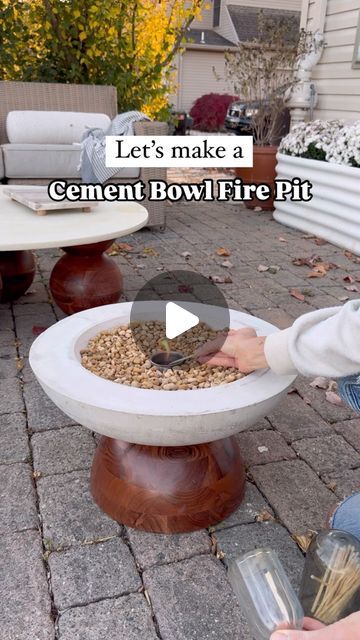 Abby Kulp  DIY | DESIGN on Instagram: "DIY Cement Fire Pit 🤩 The weather is getting chilly but November calls for cozy outdoor movie nights!! I made this large cement fire pit bowl and it added the perfect touch of coziness. 🧡  What you will need: • Large and small metal mixing bowls. (Found mine at a restaurant supply store - spent $30) • Bag of cement (Home Depot) • Canola Oil • Sander or hammer to tap/vibrate out air bubbles • Small metal cup (Found mine at Five Below) • Rubbing Alcohol  • Small stones (Home Depot)  Follow along for more DIY inspo and funnnnnnn 🫶  #patiodecor #movienight #firepit #diyprojects #outdoorfurniture #familytime #november" Diy Table Top Fire Bowl, Small Fire Pit Area, Cement Fire Pit, Metal Mixing, Cement Home, Table Top Fire, Bag Of Cement, Indoor Fire Pit, Cement Table