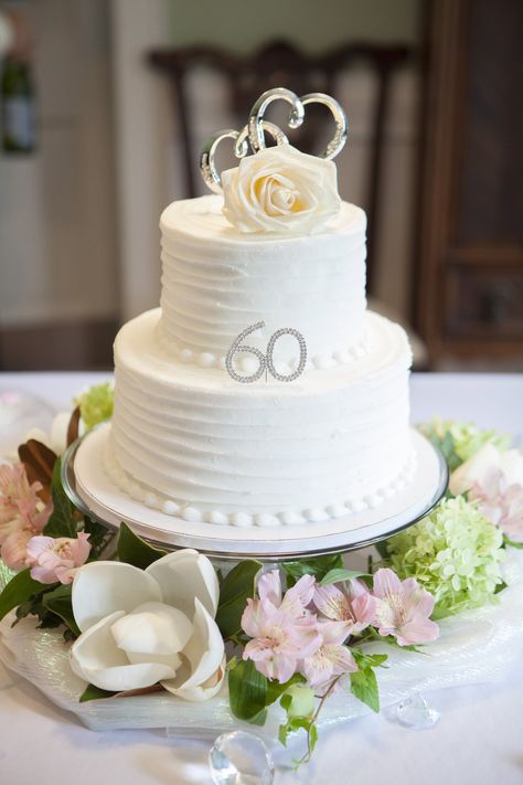 This is the cake we got for my parents anniversary party. Local bakery did the white double layered cake and I ordered the 60 and hearts off Amazon and added them and flowers on a yard of shiny fabric around the glass pedestal cake plate along with big diamonds scattered around the table to complete the look. 60th Anniversary Cake Ideas, Diamond Cake Ideas, 36 Anniversary, Anniversary Cake Pictures, 60 Wedding Anniversary Cake, Diamond Wedding Cakes, 60th Wedding Anniversary Party, 60th Anniversary Parties, Diamond Cake