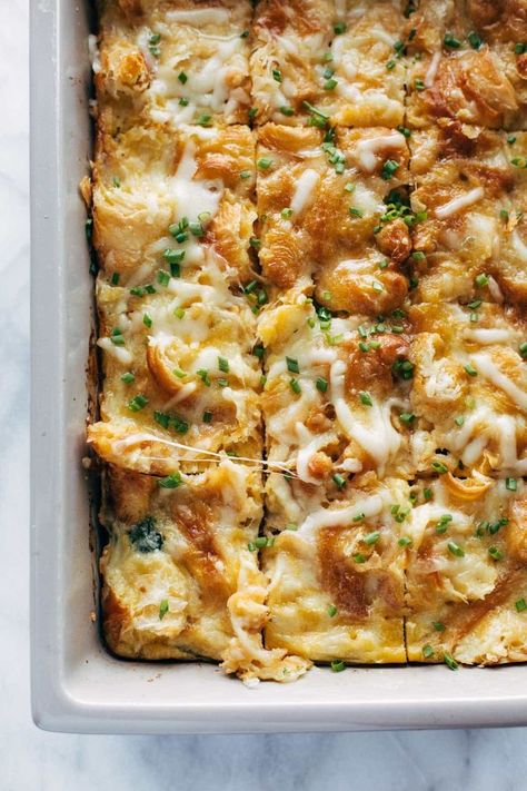 The BEST Croissant Brunch Bake! Cheese, brown sugar ham, caramelized onions, and spinach baked into creamy eggs and topped with a crispy golden croissant topping. YUM. #croissants #brunch #casserole | pinchofyum.com Recipes Made With Croissants, Vege Casserole Recipes, Baked Brunch Recipes, One Pan Brunch Bake, Croissant Topping, Brunch For Dinner, Croissant Strata, Croissant Brunch, Autumn Brunch Recipes