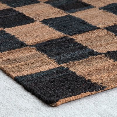 Elevate your living space with this handwoven jute and sisal area rug, designed to add a touch of natural warmth and texture. Its hand-loomed construction ensures a high-quality finish, while the reversible design offers versatility for your indoor decor. Floor heating safe, this rug is a cozy addition to any room. Keep in mind, a non-slip backing is not included, so we recommend pairing it with a rug pad to keep it in place. Enjoy the fresh, earthy feel this rug brings to your home without comp Warm Area Rug, Checkered Rug Entryway, Entryway Rug Runner, Checkered Rug Kitchen, Door Rugs Indoor, Square Kitchen Rug, Loloi Checkered Rug, Checkered Jute Rug, Checkerboard Rug