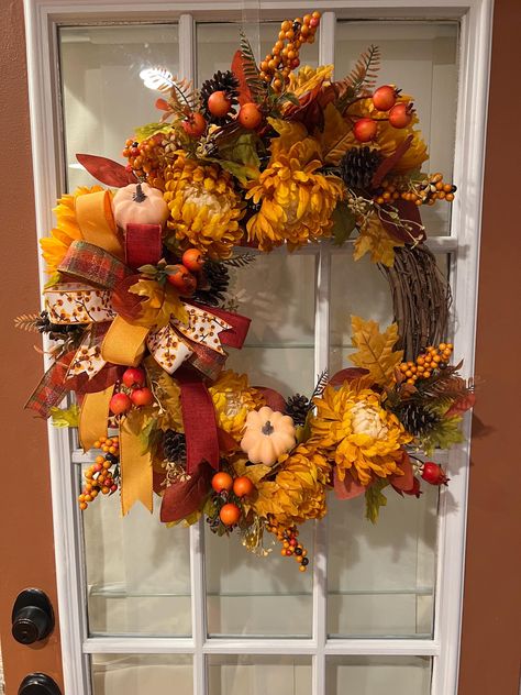 Fall Grapevine Wreath featuring Gold Mums, Light Orange Pumpkins, Berries, Pine Cones and Colorful Leaves with a multi layered Bow. Layered Bow, Fall Mums, Fall Grapevine Wreaths, Wreath Crafts, Colorful Leaves, Pumpkin Orange, Door Wreath Hanger, Light Orange, Grapevine Wreath