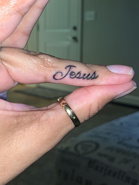 Finger Tattoo Jesus Biblical Finger Tattoos, Jesus Finger Tattoo, Finger Name Tattoos For Women, Jesus Name Tattoo, Jesus Is King Tattoo, Finger Tattoos Words, Tattoo Jesus, Bible Tattoos, Semicolon Project