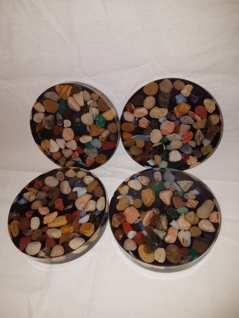 These are hand made and come in sets of four. Each coaster has felt pads on the bottom. Resin Rock Coasters, Rock Coasters, Rock Resin Coaster, Crystal Resin Coasters, Diy Resin Coasters, Agate Resin Coasters, Resin Pours, Acrylic Crafts, Geode Coasters Resin