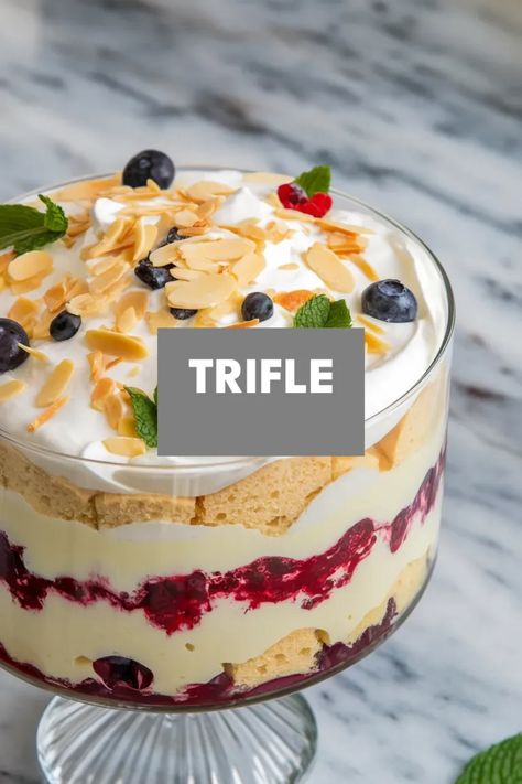 A photo of a  Trifle a christmas dessert recipe Lemon Blueberry Trifle Angel Food Cake, Triffle Desserts Holiday, Trifle Recipes Easy Simple, Snickerdoodle Trifle, No Bake Trifle Desserts, Xmas Trifle Recipes, Christmas Layered Dessert, Christmas Trifle Recipes Easy, Triffle Desserts Simple