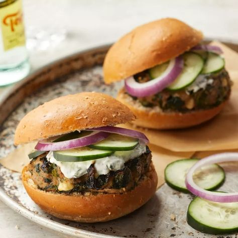 Turkey Burgers with Spinach, Feta & Tzatziki Turkey Burgers With Spinach, Feta Burger, Feta Tzatziki, Greek Turkey, Greek Turkey Burgers, Tzatziki Recipes, Eating Well Recipes, Turkey Burger Recipes, Mediterranean Diet Meal Plan