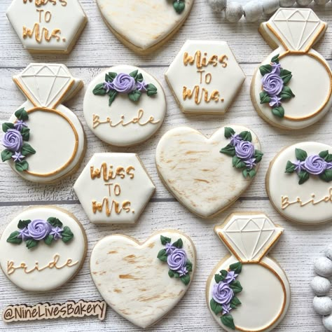 Bridal shower sugar cookies with royal icing Bridal Shower Cookies Lavender, Lavender And Gold Bridal Shower Ideas, Bridal Shower Lilac Decor, Purple And White Bridal Shower Ideas, Bridal Shower Ideas Lavender, Blue And Purple Bridal Shower Ideas, Lavender Wedding Shower Ideas, Purple Bridal Shower Cookies, Bridal Shower Ideas Purple Theme