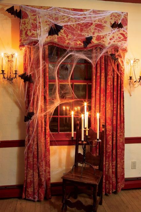 Give the inside of your windows a haunted mansion look with elaborate draperies and candelabras all covered with cobwebs and paper bats. Diy Halloween Window Decorations, Diy Halloween Window, Classic Backdrop, Diy Halloween Dekoration, Creative Vibes, Makeup Zombie, Dekorasi Halloween, Halloween Window Decorations, Table Halloween