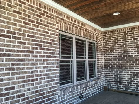 Modern appeal: Ashton Court brick combines nicely with white mortar washed with sand. Ashton Brick With Ivory Mortar, Brick Designs On Houses, Red Brick White Mortar, Red Brick With White Mortar, White Mortar Brick Exterior, Red Brick Stain, Brick With White Windows, Mortar Washed Brick Exterior, Ashton Brick