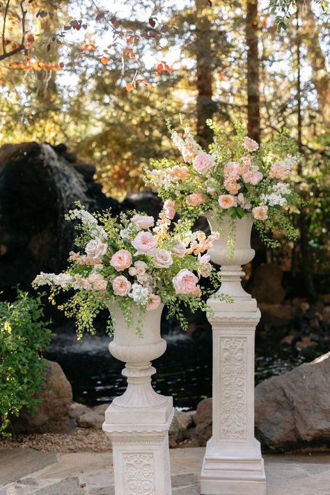 A Fairytale Wedding Ceremony Nestled Between Towering Trees Wedding Tree Flowers, Whimsical Garden Wedding Aisle, Floral Pillars Wedding Ceremony, Ethereal Wedding Decor, Wedding Florals Ceremony, White Floral Pillars Wedding, Montage Wedding, Fairytale Wedding Ceremony, Fairytale Wedding Decor