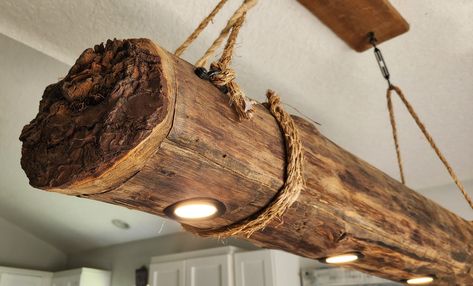 Available in various lengths. This is a handmade real wood log chandelier light lamp made from solid wood. It is one of a kind and unique. The wood is cut from the sides of trees. The electric cord is hidden inside a rope as well to blend in. It comes with the top ceiling mount board and decorative swag hooks with butterfly type toggles wall anchors to hang from your ceiling. This lamp is roughly 6" wide and 6 high. It comes in lengths of 36", 48" and 60". The rope wire runs up to your existing Log Chandelier, Rustic Wood Cabin, Beach House Lighting, Reclaimed Wood Beams, Driftwood Lamp, Recycled Glass Bottles, Cabin Lighting, Metal Figurines, Farmhouse Pendant Lighting