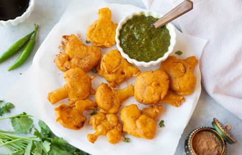 Are you looking for new ways to use the boring cauliflower you got from the grocery store? Look no further than these 12 amazing Indian cauliflower recipes. From spicy curries to crispy fritters, we've got you covered with the most delectable Indian cauliflower recipes. | pipingpotcurry.com Cauliflower Pakora, Indian Cauliflower Recipes, Easy Indian Appetizers, Vegetable Korma Recipe, Indian Cauliflower, Cauliflower Recipes Healthy, Indian Salads, Tikka Masala Sauce, Indian Soup