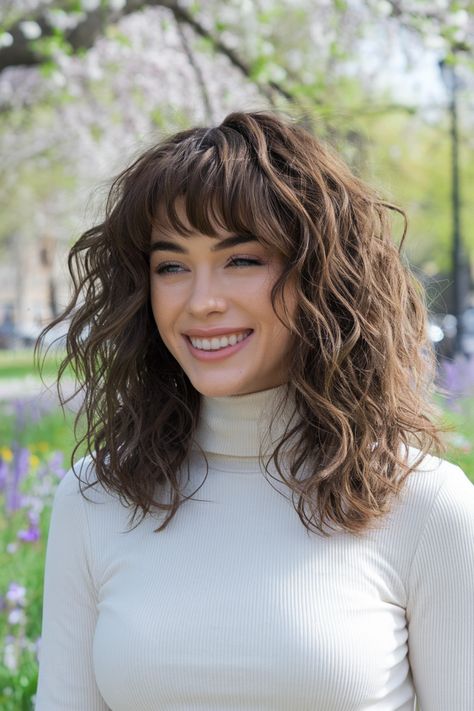 Embrace the charm of curly hairstyles paired with stylish curtain bangs! This look is perfect for medium to long hair, framing your face beautifully while enhancing your natural curls. Whether you wear it down in loose waves or half up for a playful vibe, this hairstyle is a summer favorite that’s easy to achieve. Perfect for any occasion, you'll definitely turn heads! #curlyhairstyles Loose Waves With Bangs, Curly Hairstyles With Curtain Bangs, Hair Framing, Curtain Bangs Curly Hair, Hairstyles With Curtain Bangs, Medium Curly Haircuts, Medium To Long Hair, Medium Curly, Cute Curly Hairstyles