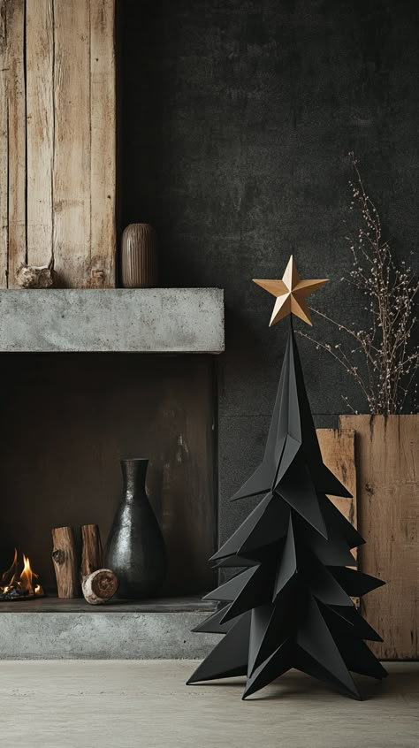 Minimalist black origami Christmas tree in front of a fireplace, with vases and a wooden star, against a dark concrete wall. Minimalist Black Home Decor, All Black Christmas Decor, Gray Christmas Tree Decor, Modern Black Christmas Tree, Black Xmas Tree Decorating Ideas, Masculine Christmas Tree, Black Theme Christmas, Moody Accent Wall, Minimalistic Christmas Tree