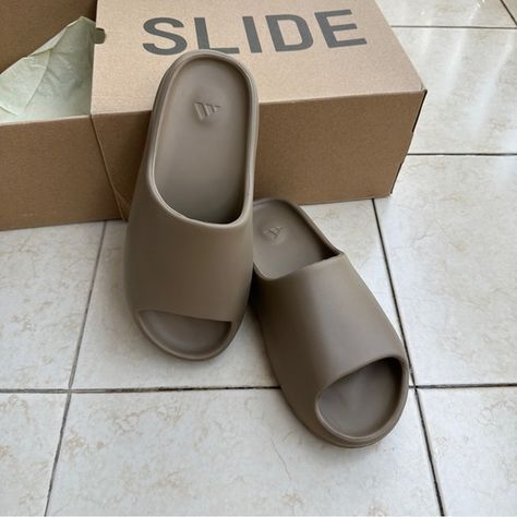 Yeezy Slide Earth Brown Unisex Mens Yeezy, Adidas Slides, Yeezy Slides, Mens Slides, Yeezy Shoes, Azure Blue, Brown Fashion, Flip Flop Sandals, Slip On Sandal