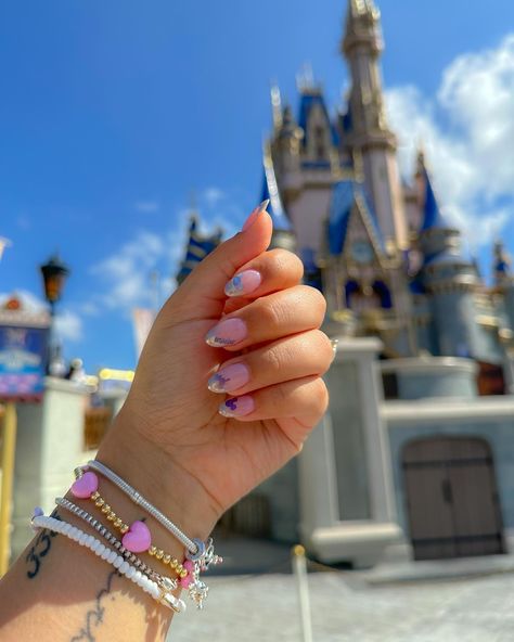 Disney mani magic ✨ My nails over our past trips! I love doing a fun nail design for our Disney trips, it really puts me in the vacay mood and makes me feel extra magical looking down and seeing a touch of Disney. What nail design should I do for my next trip? #nailart #nailstickers #disneynails #disneyworld #disneystyle #disney100 #nailinspo #engagementring #disneybride #naildesign #disneygirl #disneycreators #ovaldiamond #engaged Disney Universal Nails, Birthday Disney Nails, Universal Nails, Disney World Nails, Disney Themed Nails, Vacay Mood, Themed Nails, Disney Bride, Teen Shorts