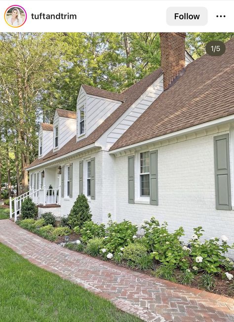 Cottage Front Landscaping, Farmhouse Hydrangea Landscape, French Cottage Landscaping, Front Yard Hydrangea Landscaping, Courtyard Front Of House, Green Shutters White House, New Home Exterior Ideas, Adding Character To A Builder Grade Home, Painted Brick Cottage