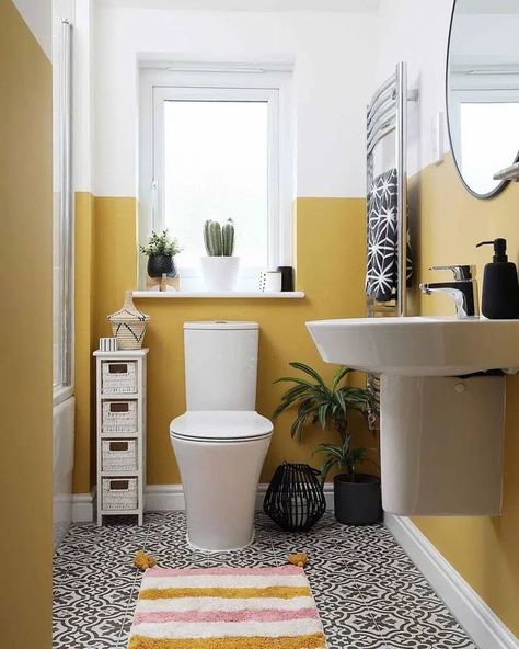 An efficient and stylish minimalistic storage solution by the toilet complements the two-toned yellow walls in this compact bathroom. Image credit: INSTAGRAM @STYLE_THE_HAWTHORNS Colorful Small Bathroom, Small Bathroom Paint, Toilet Room Decor, Small Toilet Room, Small Space Bathroom, Compact Bathroom, Retro Bathrooms, Minimalist Kitchen Design, Downstairs Toilet