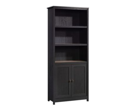 Update your home with the charming style of this Sauder Cottage Road Black Bookcase. This piece features three large open shelves that provide you with the perfect amount of space to store and display an array of items like your favorite novels and organizing bins. The two upper shelves are adjustable, providing you with the ability to move them to different heights to create flexible storage options for items of all shapes and sizes. Located in the cabinet below is an additional shelf to store Store Board Games, Black Bookcase, Library Bookcase, Office Bookcase, Update Your Home, Cabinet Shelving, Favorite Novels, Organizing Bins, Open Shelves