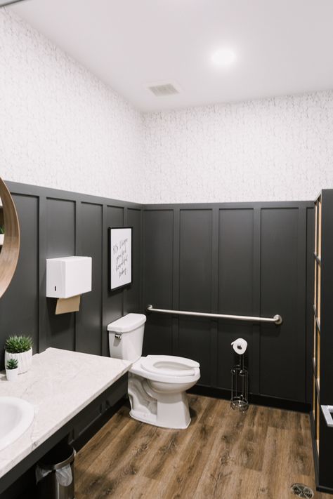 Love this bathroom makeover on a budget! The before and after of this DIY bathroom makeover is amazing! We did this is two commercial hair salon bathrooms, but you could do the same design in a full bathroom, half bath, or small space too! Great ideas for mixing black, white, and woods (especially walnut!). Love the board and batten and perfect face and hair wallpaper! A beautiful, quick (& fairly cheap!) transformation! #bathroom #weekendrenovation #boardandbatten #charcoal #walnut Hair Salon Bathroom, Bathroom Half Bath, Home Paint Colour, Commercial Bathroom Ideas, Salon Bathroom, Bathroom Makeover On A Budget, Commercial Bathroom Designs, Hair Wallpaper, Using A Paint Sprayer