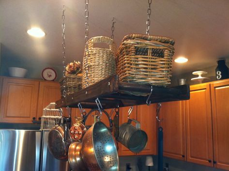 "This is a shorter version of our traditional pot rack.  (The photos are of our traditional 4 foot pot rack which has 5 steps.) The ladder is approximately 3 feet 4 inches long, and approximately 15\" wide.  The side rails are constructed with 1\" x 3\" distressed nominal wood which is designed to the scale of a vintage ladder.   It is designed for smaller kitchens. We included four \"eye\" hooks for the top to hang the ladder, and eight \"eye\" hooks for the bottom to decorate as you please. Yo Kitchen Island Pot Rack, Ladder Pot Rack, Rustic Pot Racks, Pot Rack Kitchen, Pan Hanger, Pan Holder, Distressed Kitchen, Rustic Pots, Pan Storage