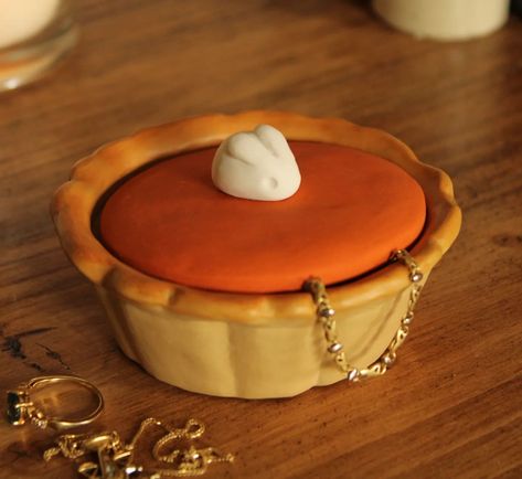 I've been thinking about this one for a while, I thought it would look too plain and simple, especially compared to the pancakes. Bringing autumn warmth back to this cold rainy spring 🍃 #pumpkinpie #pumpkinspice #pie #bunny #rabbit #americanfood #fakefood #clayfood #polymerclay #jewellerybox #giftideas #autumnvibes🍁 #autumndecor #deskdecor #storage #ceramicartist #ceramicpots #pottery #warmtones Rainy Spring, Pinch Pot, Aesthetic Feed, Pinch Pots, Clay Food, Ceramic Pots, Fake Food, American Food, Ceramic Artists