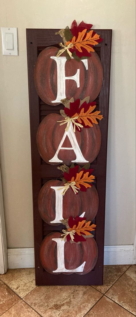 I found a bunch of vinyl shutters from a house near me that is updating their exterior. I bought the pumpkins, paint, jute, leaves from dollar tree and made a few signs. Cost maybe $6 a sign and they really look nice! Diy Fall Pallet Signs, Wooden Shutter Craft Ideas, Fall Shutter Crafts, Fall Front Porch Signs Wooden Diy, Fall Shutter Ideas, Shutter Crafts, Fall Boards Signs, Rustic Wall Decor Diy, Shutters Repurposed Decor