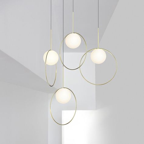 Bola is an elegant suspension light composed of a globe and a ring that can be configured in a variety of linear or round arrangements. This new Pablo design is currently on sale during our Fall Lighting Sale Halo Chandelier, Cluster Lights, Steel Canopy, Globe Pendant Light, Multi Light Pendant, Brass Pendant Light, Halo Pendant, Canopy Lights, Suspension Light