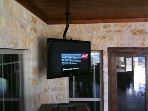 ceiling mounted TV for bedroom on a 360 swivel. May need a tiny ... Tv Hanging From Ceiling, Ceiling Mounted Tv, Outdoor Tv Mount, Patio Tv, Outdoor Tv Cabinet, Tv Ceiling Mount, Ceiling Tv, Perry Homes, Flat Screen Tv