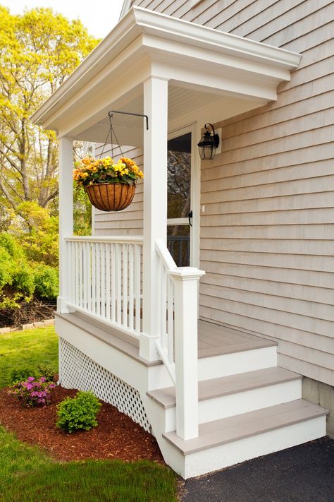 This home was initially a typical Cape Cod ranch; one level with a closed-off living room, kitchen and dining room, and three very small bedrooms. Patriot Builders began by razing the existing home almost completely, leaving only the foundation and one exterior wall in place. The remodeled home has an open living room/kitchen/dining room with … Cottage House Exterior, Farmhouse Porch Decor, Side Entrance, Porch Remodel, Small Cottage Homes, Building A Porch, Side Porch, Porch Steps, Front Steps