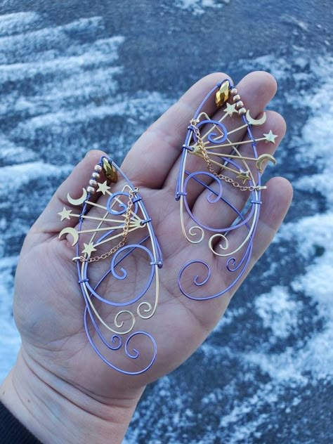 Moon and Stars Lavender, Gold COLOR You will receive a right and a left with this order. This is made to order in 3 to 5 business days of purchase. Elf ear cuffs are lightweight, stylish and one size fits all. You'll find a pair that is suitable for any event be at the Renaissance Fair, a fairy festival, or just a fun night out on the town! All Elf Ear Cuffs are made with artistic wire, silver plated non-tarnish copper, Nickel free. All Cuffs come as a set and easily fit any size ear by gently a Moon Fairy Cosplay, Star Fairy Costume, Moon Elf Costume, Celestial Fairy Costume, Moon Fairy Costume, Elf Aesthetic Outfit, Fairy Elf Costume, Fairytale Accessories, Celestial Fairy