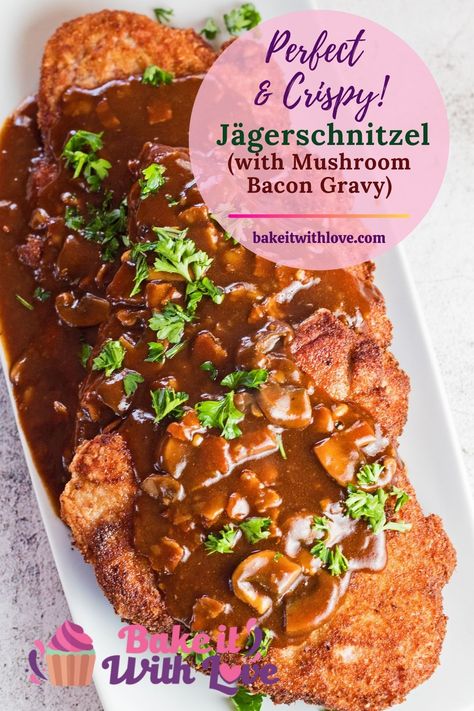 The classic German Jägerschnitzel combines tender, crispy-fried breaded pork cutlets served with a deliciously rich bacon mushroom gravy! This is truly a hearty pork entree that the whole family will love any day of the week served with potatoes or spätzle! bakeitwithlove.com | #bakeitwithlove #easy #recipe #classic #best #authentic #vintage #German #Jägerschnitzel #huntersschnitzel #schnitzel #mushroomgravy #Germany #gravy #authentic #jaegerschnitzel #rezept #porkcutlets #panfriedpork German Schnitzel With Mushroom Gravy, Authentic German Spaetzle With Mushroom Gravy, Schnitzel Recipe Pork, Jager Schnitzel, Pork Snitzel Recipe Germany, Yager Schnitzel Recipe, Pork Schnitzel Recipe Gravy, Jager Schnitzel Recipe Mushroom Sauce, Jager Schnitzel Recipe