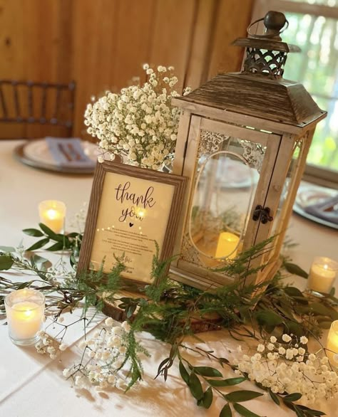 Long Table Wedding Centerpieces Rustic, Lantern Themed Wedding, Rustic Lantern Centerpieces Wedding Table Decorations, Table Centerpiece With Lantern, Centerpieces Wedding With Lanterns, Center Piece With Lanterns, Wildflower Lantern Centerpiece, Rustic Wedding Lanterns, Wedding Decorations With Lanterns