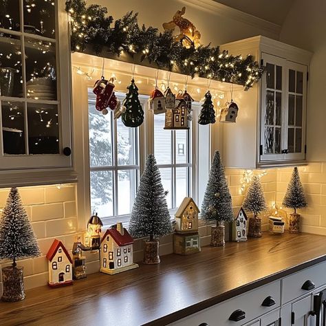 Lady hates the empty space above her kitchen cabinets, comes up with this creative solution that's perfect for Xmas Over Cabinet Christmas Decor Kitchen, Christmas Kitchen Cabinet Decor Above, Above Cabinet Decor Christmas, Above The Cabinet Christmas Decor, Above Cabinet Decor Kitchen Christmas, Above Kitchen Cabinet Christmas Decor Ideas, Above Cabinets Christmas Decorations, Christmas Decorations Above Cabinets, Christmas Kitchen Cabinet Decor Ideas