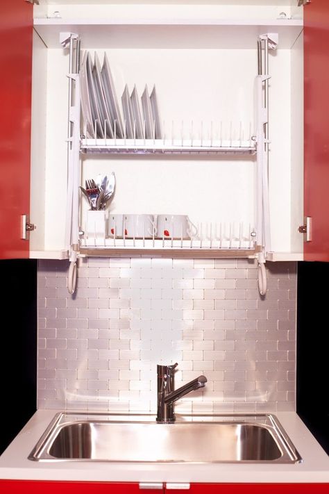 A clever solution is the Drip Dry that is the first multi-use draining system kit for kitchen cabinets that instantly improves lifestyle and a kitchen’s appearance. Easy to install, it is used as a dishrack, colander, soap and sponge storage. It hides clutter, clear counter space and save time. Dish Drying Cabinet, Cabinet Dish Rack, Dish Rack Cabinet, Drying Cabinet, Kitchen Decor On A Budget, Dish Dryer, Vintage Bathroom Tile, Bathroom Inspiration Colors, Kitchen Facelift