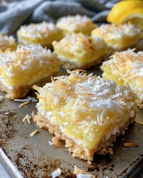 This recipe is a hit! My niece always snags the first one off the table. Definitely a crowd-pleaser. Lemon Coconut Bars, Lemon Squares, Square Recipes, Coconut Bars, Lemon Dessert Recipes, Lemon Coconut, Cookie Bar Recipes, Coconut Recipes, Lemon Desserts