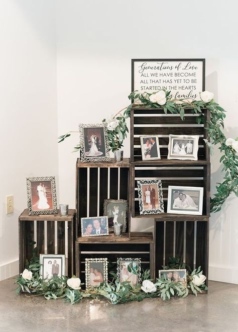 When a client contacts us with a unique idea for their big day, we are happy to bring it to life! Elyse & Josh's wedding featured our wooden crates filled with photographs among some of our most gorgeous faux flowers—a perfect display! #illumepghdesign #burghbrides #weddingdesign #eventdecorator #weddingdecorator #weddingday #weddingdecorations #weddingplanning #weddinginspiration #weddingdetails #instawedding #generationsoflove #photodisplay #woodencrates #fauxfloral #whitebarnwedding Wooden Crate Ideas Wedding, Wedding Memory Wall, Crate Wedding Decor, Wooden Crates Wedding, Wood Crate Shelves, Wedding Crates, Anniversary 50th, Wedding August, Wedding Photo Display