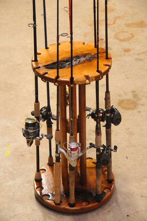 Solid Mesquite rod and reel holder. This Rod holder holds 16 rods and has a individual lock for each rod.  Mounted on a "Lazy Susan" so the entire unit spins to get the equipment in front of you. Diy Fishing Rod Holder, Fishing Pole Rack, Fishing Pole Storage, Diy Fishing Rod, Fishing Rod Stand, Fishing Rod Holders, Fishing Pole Holder, Fishing Storage, Fishing Rod Storage