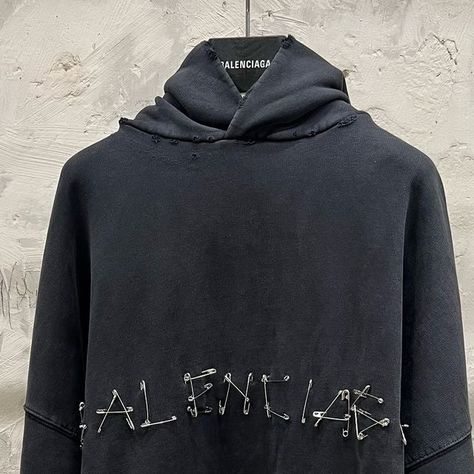 mfw on Instagram: "New: Safety Pins Hoodie & T-Shirt from Balenciaga Winter24  Large fit Inspired by a DIY aesthetic, these pieces are characterized by their use of safety pins to spell out ‘Balenciaga’ Distressing and fading is found throughout the garments, giving them the appearance of heavy usage  A similar concept can be seen on the ‘Tape Type’ pieces from Summer23, the logo being spelled out with tape artwork  Photos are mine  #demna #demnagvasalia #balenciaga" Demna Balenciaga, Clothing Brand Inspiration, Balenciaga Aesthetic, Graphic Hoodies Aesthetic, Balenciaga Hoodie, Fit Inspired, Essential Clothing, Balenciaga Clothing, Hoodies Aesthetic