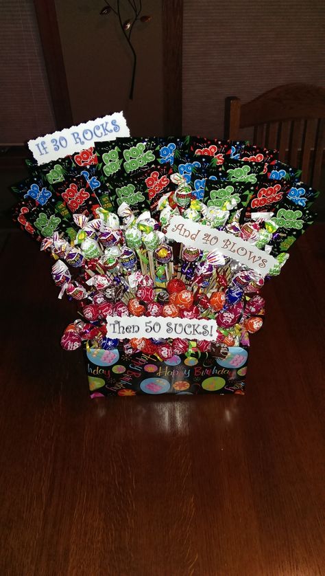 30 Rocks 40 Blows 50 Sucks Fun 50th birthday gift / centerpiece. Consists of 30 packages of PopRocks, 40 Blow pops and 50 Tootsie roll suckers. Some people switch it to 50 Rocks, but I was being funny to the birthday girl :) Fun 50th Birthday Gifts, 40 Blows, 50 Rocks, 50th Birthday Gag Gifts, Moms 50th Birthday, Blow Pops, 50th Birthday Party Decorations, Candy Bouquets, 50th Birthday Decorations