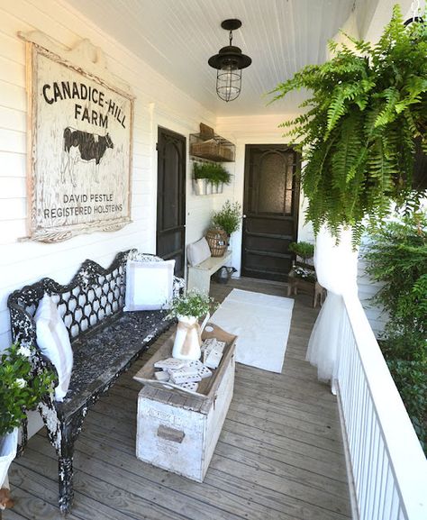 Farmhouse porch dressed in a vintage style (from Laurie Anna's Vintage Home)