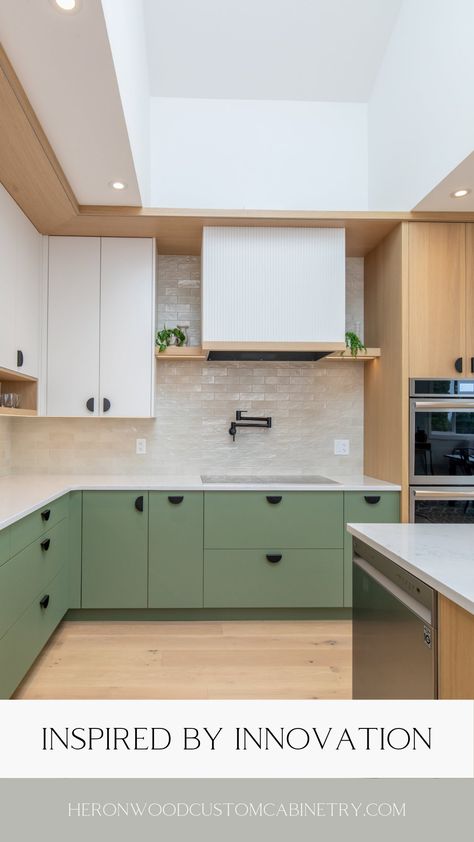 The perfect green for your home.   The nature-inspired green kitchen trend is becoming increasingly popular and offers a calming, tranquil feel to your space. A sage kitchen can add that pop of colour while keeping design schemes neutral. Explore Heronwood’s kitchen cabinetry portfolio for inspiration and give your home a new lease of life today!  #ModernKitchen #CustomCabinetry #LuxuryHomes #HomeDesign #VancouverIslandHomes #LuxuryRealEstate Sage And Wood Kitchen, Green Beige Kitchen, Mint Green Kitchen Ideas, Sage Green Kitchen Colour Scheme, Green And White Kitchen, Green Kitchens, Sage Kitchen, Kitchen Colour Combination, White Oak Kitchen