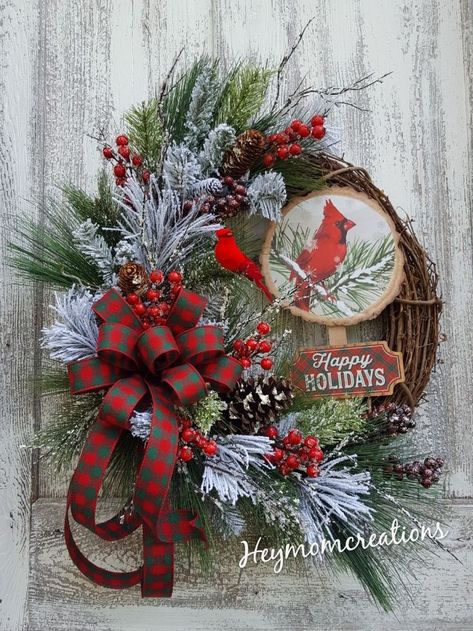 This beautiful Rustic Cardinal Christmas wreath is made on an 18" grapevine base with snowy pine greenery, red berries, iced twigs, pinecones, happy holiday cardinal sign and a pretty green and red ribbon bow with a red bird perched on a limb. -Measures Approx: 25"Lx22" W Grapevine Christmas, Red Christmas Wreath, Christmas Decorations Centerpiece, Winter Wreath Diy, Floral Door Wreaths, Burlap Wreath Diy, Cardinal Christmas, Rustic Christmas Wreath, Christmas Mesh Wreaths