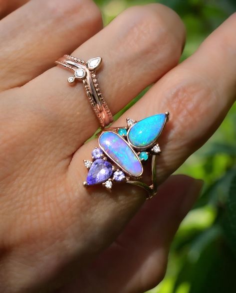 This new Aqua Lavender Double Opal Ring with Tanzanite, Paraiba Tourmalines, and diamonds in Rose gold is sort of a hybrid design between a Trinity and a Narwhal Ring! What do you think of this magical being? Opal And Tanzanite Ring, Opal And Pink Tourmaline Ring, Spiritual Multi-stone Opal Ring, Purple Tanzanite Multi-stone Rings, Oval Tanzanite Multi-stone Ring, Paraiba Tourmaline, Handmade Angels, Split Shank Ring, Hybrid Design