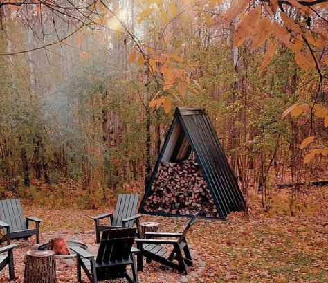 Small Fire Wood Storage, A Frame Wood Storage, A Frame Firewood Storage, Triangle Firewood Storage, Wood Shed Ideas Firewood, Cabin Outdoor Firepits, Campfire Wood Storage Diy, Firewood Shelter, Campfire Place Garden