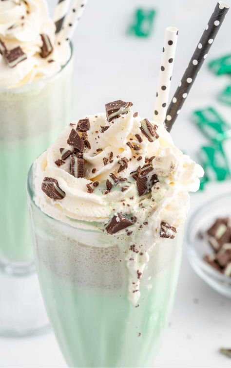 close up shot of Mint Chocolate Chip Milkshake in a tall glass topped with whipped cream and pieces of mint Chocolate Ice Cream Milkshake, Chocolate Chip Milkshake, Mint Milkshake, Mint Chocolate Chip Milkshake, Andes Mint Chocolate, Homemade Milkshake, Milkshake Recipe Chocolate, Mint Chocolate Ice Cream, Homemade Coffee Creamer