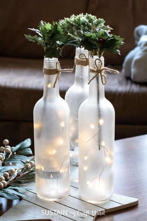 Wine Bottle Table Decorations, Wine Bottle Lights Centerpiece, How To Frost Wine Bottles, Empty Wine Bottle Ideas, Empty Wine Bottle Ideas Decor, Wine Bottle Centerpieces For Wedding Diy, Wine Bottle Crafts Wedding, Wedding Bottle Decorations, Wine Bottle Centerpieces For Wedding