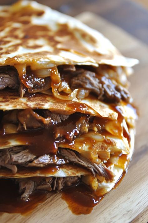 Combine the savory goodness of a classic Philly cheesesteak with the crispy delight of a quesadilla. Tender slices of steak, melted cheese, and sautéed peppers and onions are folded into a golden tortilla for a mouthwatering fusion meal. #CheesesteakQuesadilla #FusionCuisine #EasyDinner Philly Steak And Cheese Omelet, Philly Steak Quesadilla, Cheesesteak Quesadilla Recipes, Philly Cheese Steak Quesadilla, Steak Quesadilla Recipe, Cheese Steak Quesadillas, Steak Quesadilla Recipes, Steak Quesadillas, Sautéed Peppers