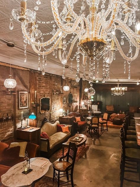 Good Vintage: Chemistry Wine Brings Cozy Antique Vibes to a Wine Bar Setting | Bars | Hudson Valley | Chronogram Magazine Coffee Shop Chandelier, Wine Shop Decor, Moody Wine Room, Wine Bar Seating, Wine Bar Ideas Restaurants, Vintage Bar Aesthetic, Vintage Cafe Aesthetic, Bar Window Display, Wine Boutique Shops